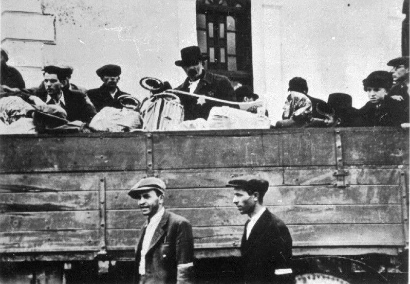 Jews being carried away by truck